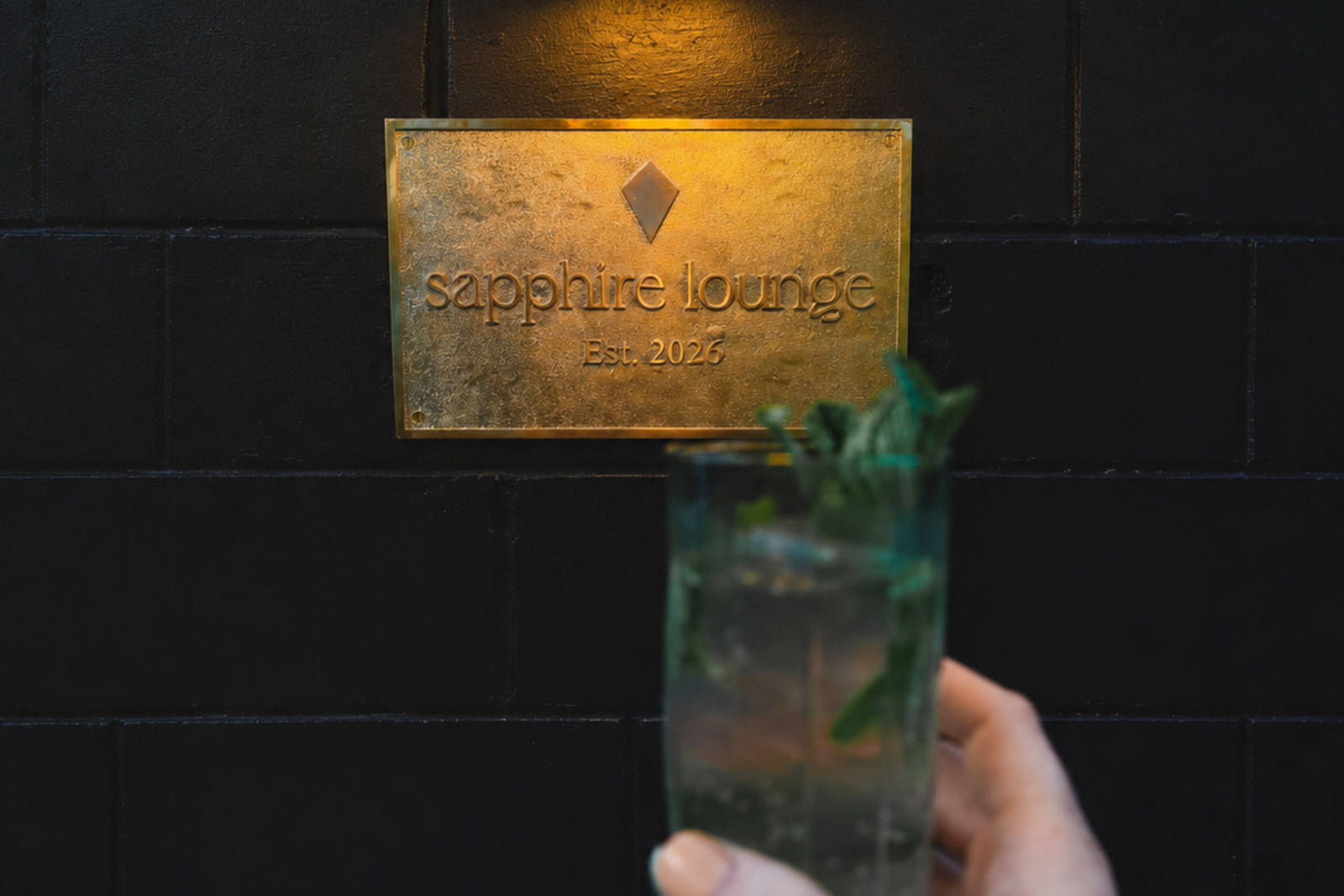 Brass Sapphire Lounge sign, established 2026